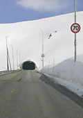 tunnel approaching and high roadsigns to avoid being buried