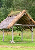 open outbuilding with thatched (straw) roof